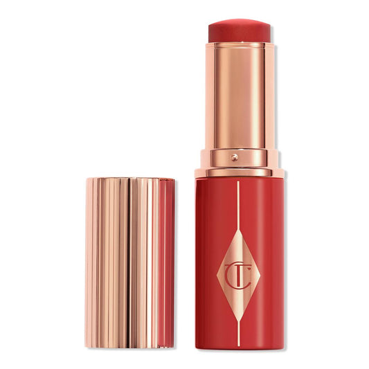 Unreal Lip + Cheek Glow · Rubor en barra